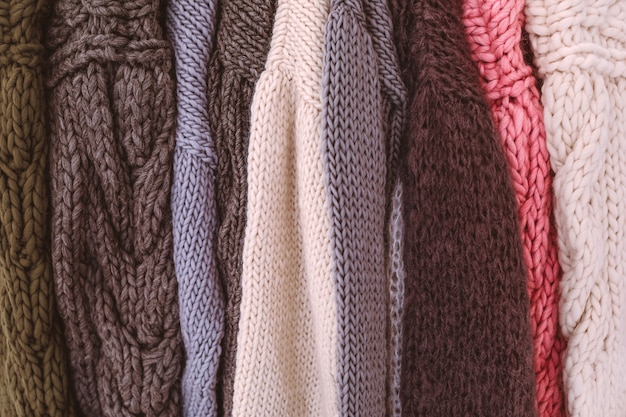 Premium Photo | Bunch of knitted warm colourful cozy sweaters with ...