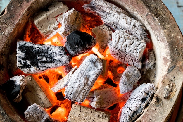 Burning charcoal with flame | Premium Photo