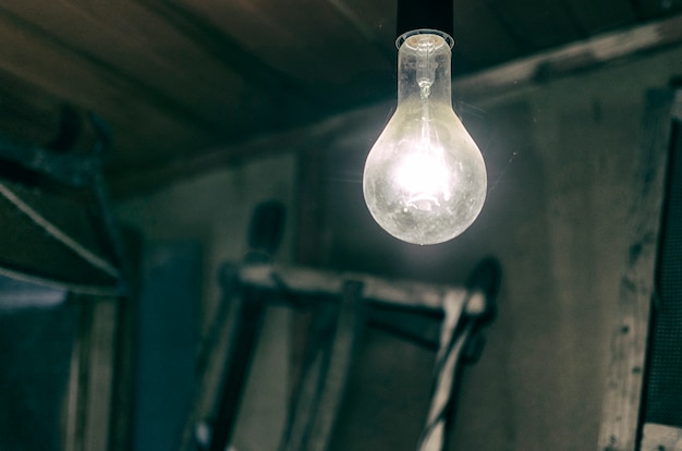 Burning Light Bulb In An Old Barn Photo Premium Download