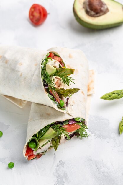 Premium Photo | Burritos with fried chicken and vegetables asparagus ...