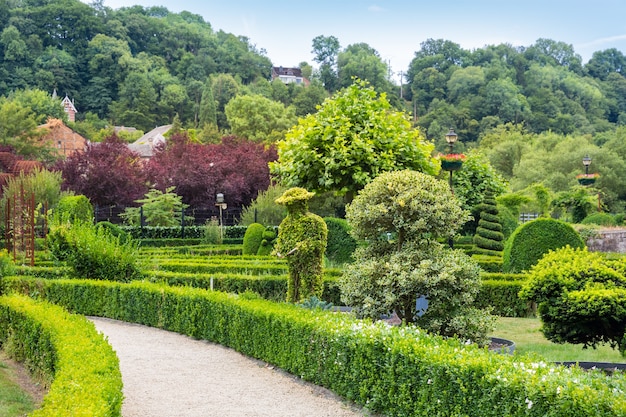 Premium Photo | Bushes in different shapes, summer park in europe ...