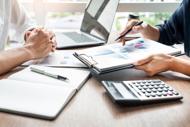 Premium Photo | Business executives discussing document work at meeting ...