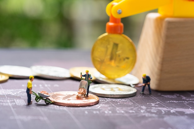 Business and finance, miners working in bitcoin mine. Premium Photo