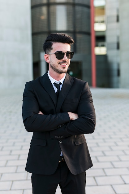 Free Photo | Business man in front of the office building