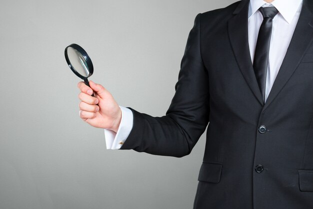 Premium Photo Business Man Holding Magnifying Glass Concept 8652