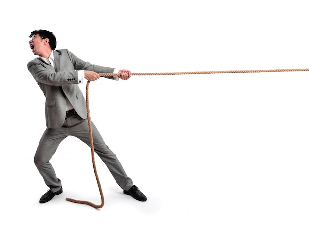 Business man pulling on a rope Free Photo