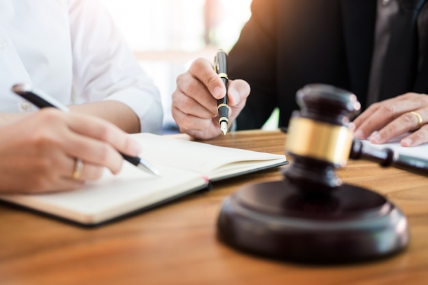 Premium Photo | Business people and lawyers discussing contract papers  sitting at the table. concepts of law, advice, legal services