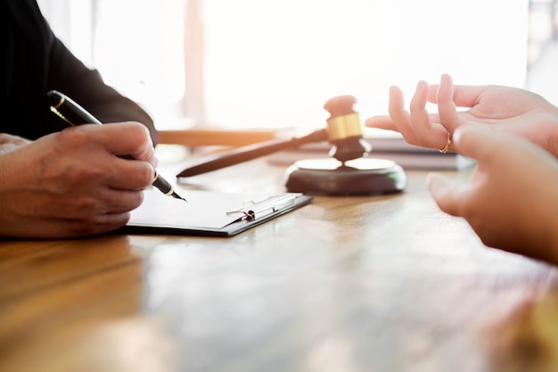 Premium Photo | Business people and lawyers discussing contract papers sitting at the table. concepts of law, advice, legal services