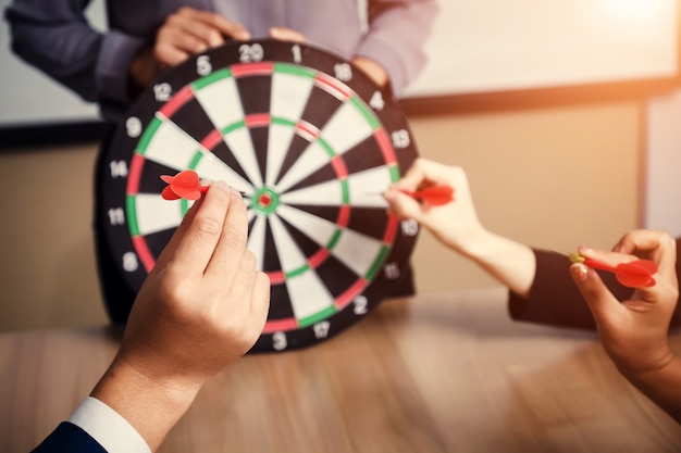 Business team pointing to a darts aiming at the target center business,targeting the business concept Premium Photo