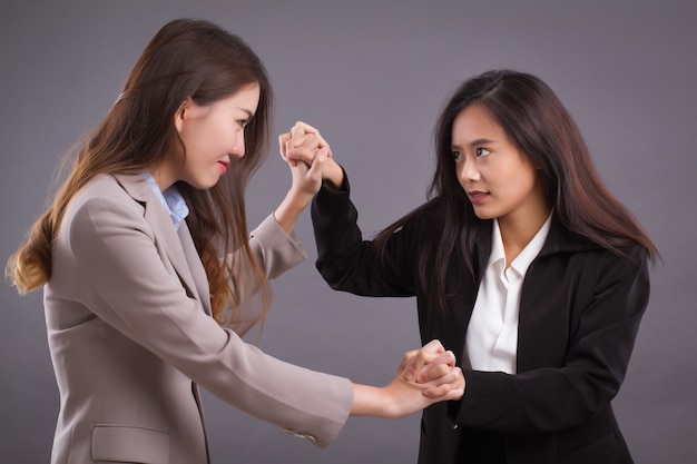 premium-photo-business-women-competing-fighting-for-superiority