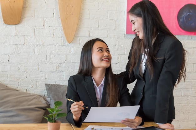 Premium Photo | Business women work together happily at workplace.