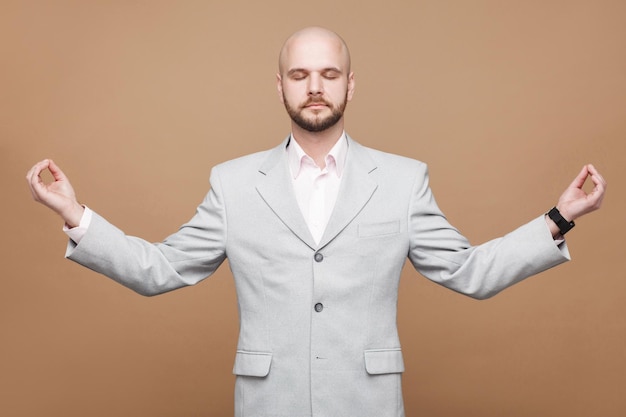 Premium Photo | Businessman in classic light gray suit standing with ...