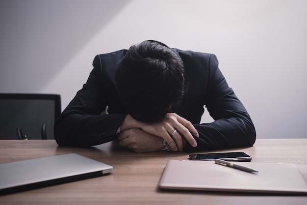Businessman failing and serious in office Premium Photo