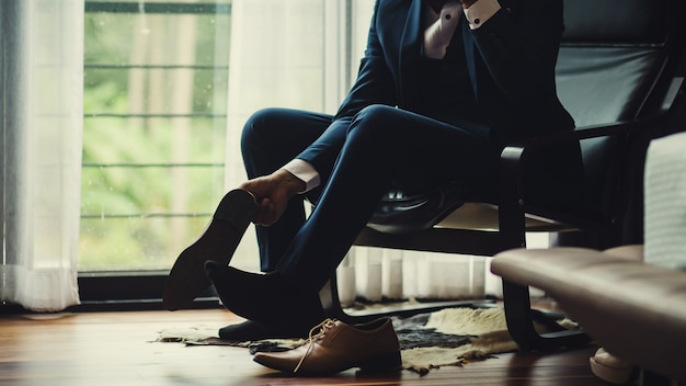 Premium Photo Businessman or groom tied a shoelace on his shoes