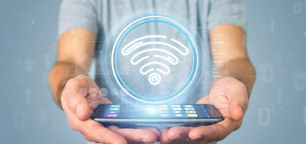 Businessman holding wifi icon with stats and binary code Premium Photo