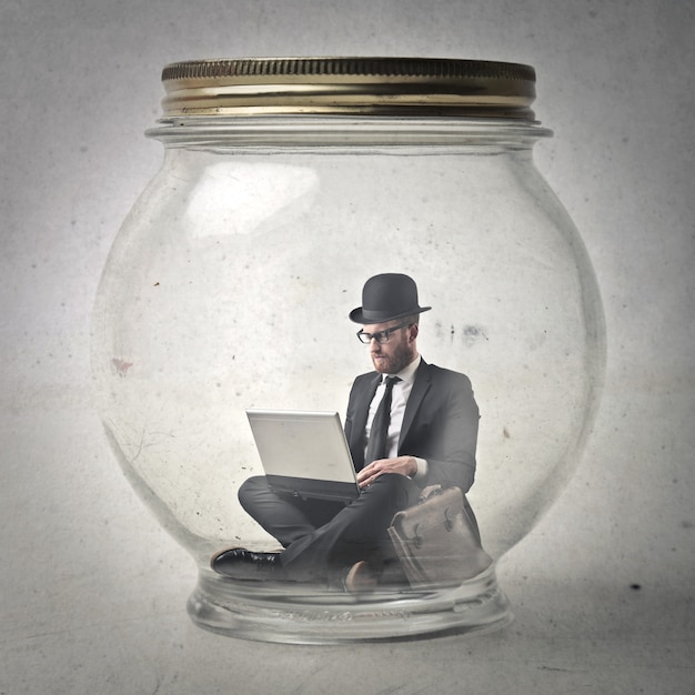 Premium Photo Businessman in a jar