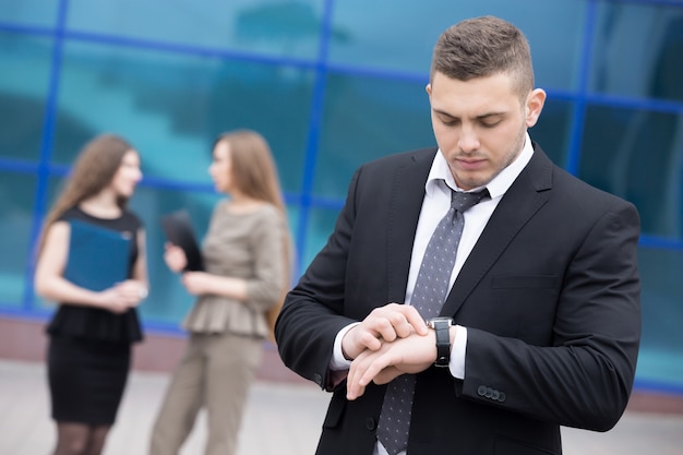 Businessman looking at his watch Photo | Free Download