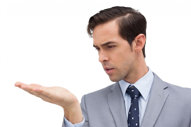 Premium Photo | Businessman looking at his hand