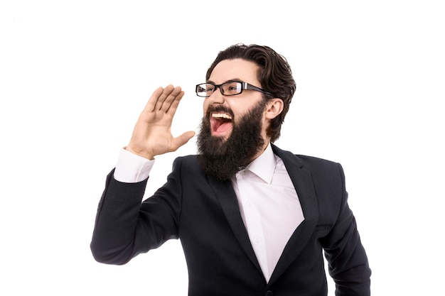 Premium Photo | Businessman shouting and holding hand near the mouth ...