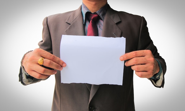 Premium Photo | Businessman showing blank paper