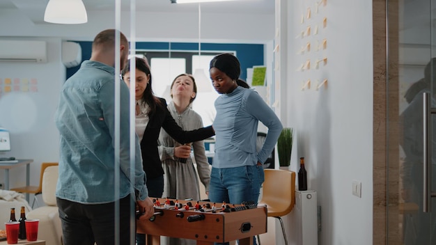 Free Photo | Businessman winning soccer game at foosball table, playing ...