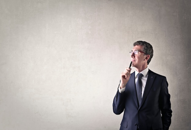 Premium Photo | Businessman wondering and thinking