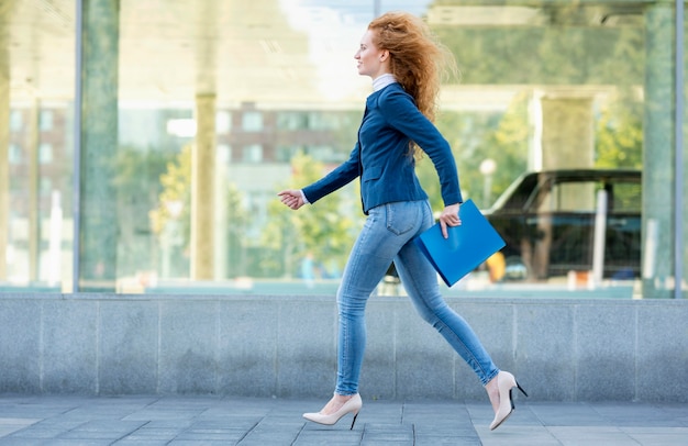 Free Photo | Businesswoman running in high heels