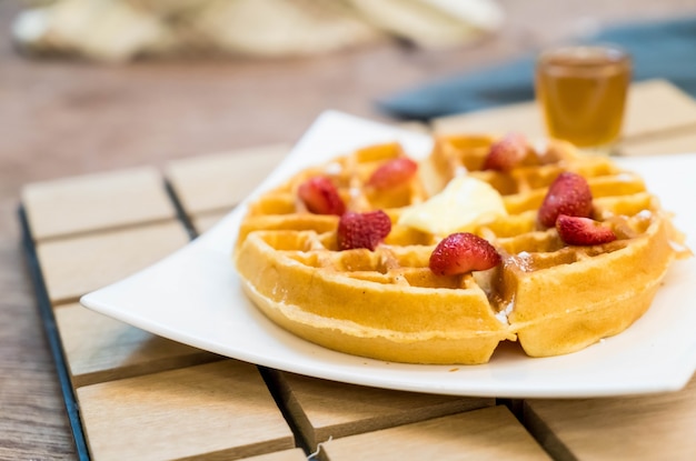 Butter waffle with honey and strawberry Photo | Free Download