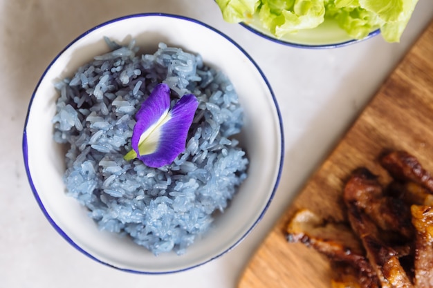 Premium Photo | Butterfly pea purple sticky rice, decorated with ...