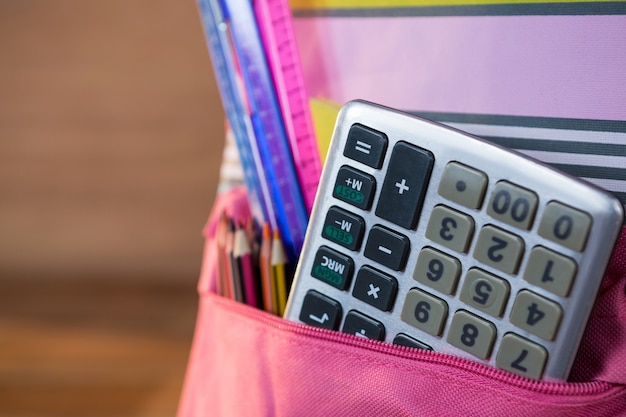 Calculator in school bag | Free Photo