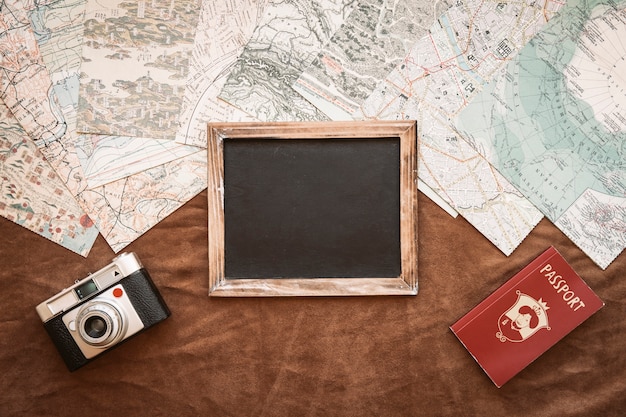 Free Photo Camera Passport And Blackboard On Maps