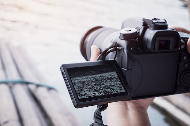 Cameraman set video camcorder or professional digital dslr on tripod for camera recording taking photo Premium Photo