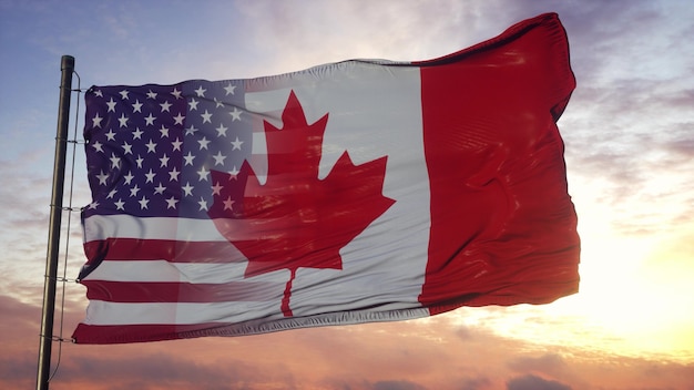 カナダ​と​アメリカ​の​旗竿​に​旗​を​立てる​。​風​に​揺れる​アメリカ​と​カナダ​の​混合旗 Premium写真
