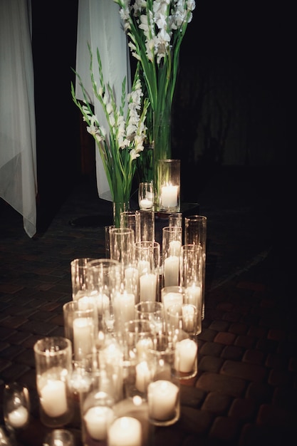 Candles Burn Standing In Tall Vases On The Floor Free Photo