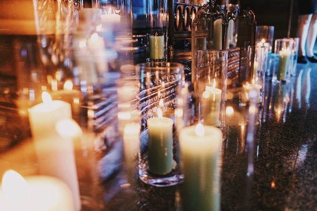 Candles In Tall Vases Stand On The Floor Free Photo