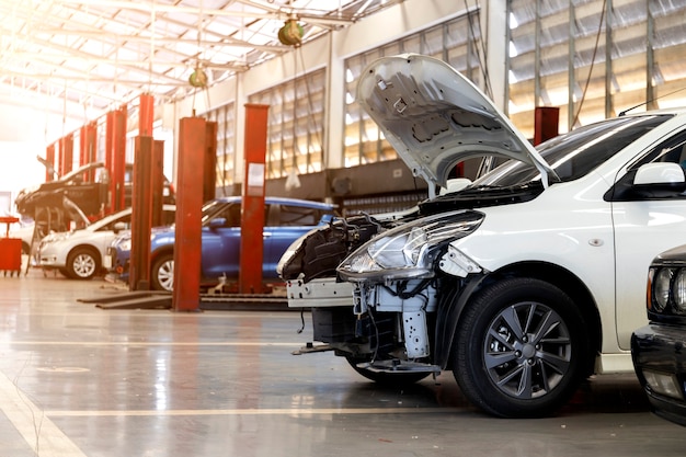 Premium Photo | Car in automobile repair service center with soft-focus ...