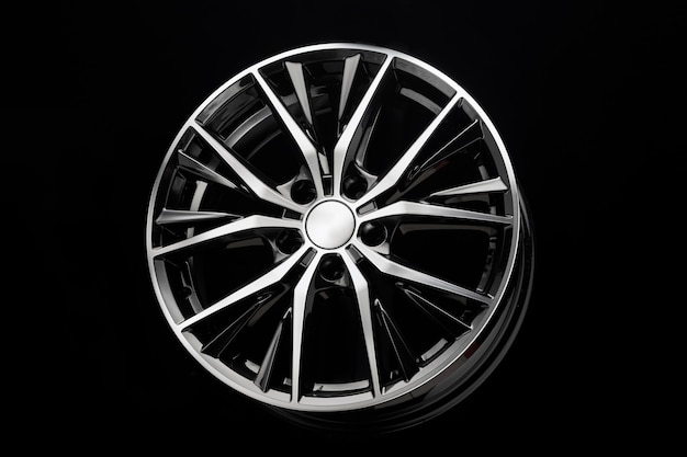 Premium Photo | Car black alloy wheel elegant with thin curved spokes ...