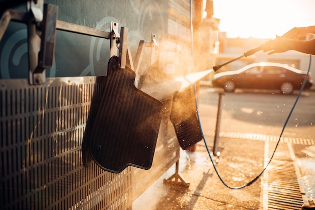 Premium Photo | Car carpets washing with high pressure ...