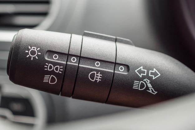 Premium Photo | Car light control switch close up