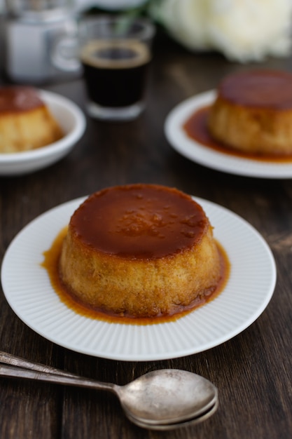 Premium Photo | Caramel flan, crema catalana dessert on dark brown ...