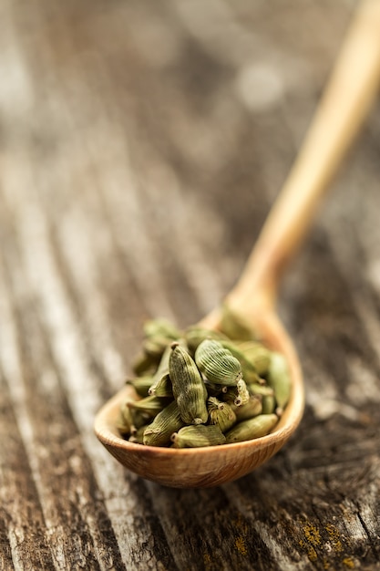 Premium Photo Cardamom Seasoning In A Wooden Spoon Close Up