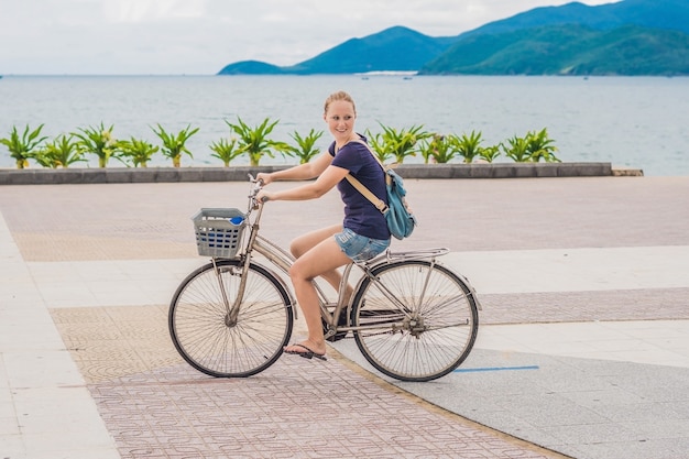 can you put a basket on any bike - a woman riding a bicycle with a basket 