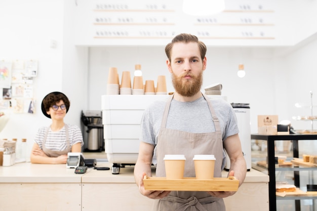 Premium Photo | Carrying tray with takeout coffee cups