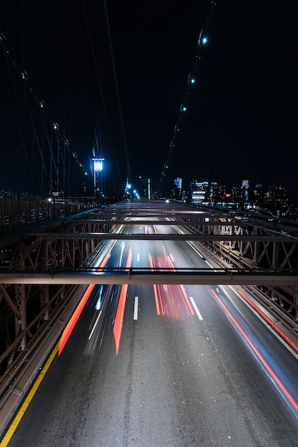 Free Photo | Cars on bridge with motion blur at night