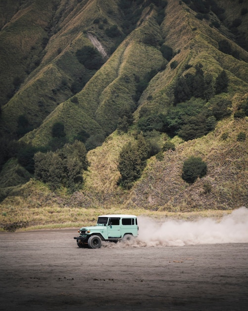 premium-photo-cars-driving-on-a-beach