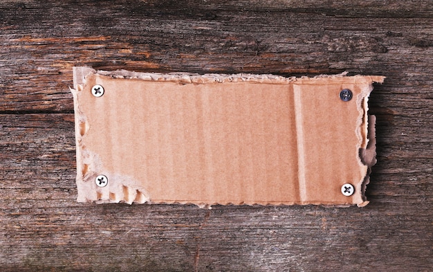 Free Photo | Carton frame on wooden texture