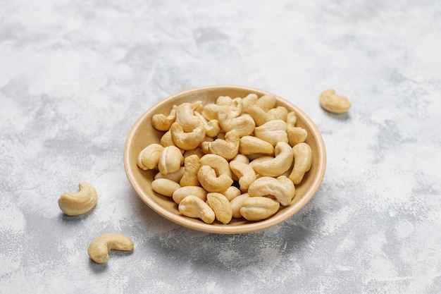 Cashew nuts in ceramic plates.top view Photo | Free Download