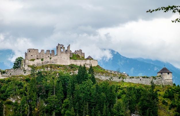 Premium Photo | Castle ruins in the austrian alps in a cloudy day ...