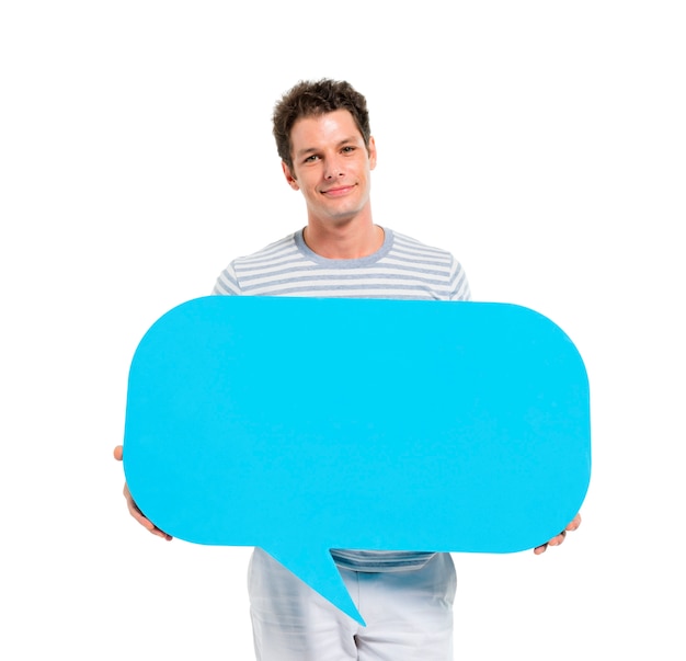 Casual young adult man holding speech bubble Free Photo