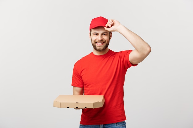 Download Premium Photo | Caucasian handsome pizza delivery man holding pizza boxes